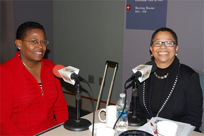 During the MED Week Conference, Carolyn Green (on left) talks with Sharmain Matlock‐Turner, co‐host of Financial Voices, about acquisition as a path to entrepreneurship.
